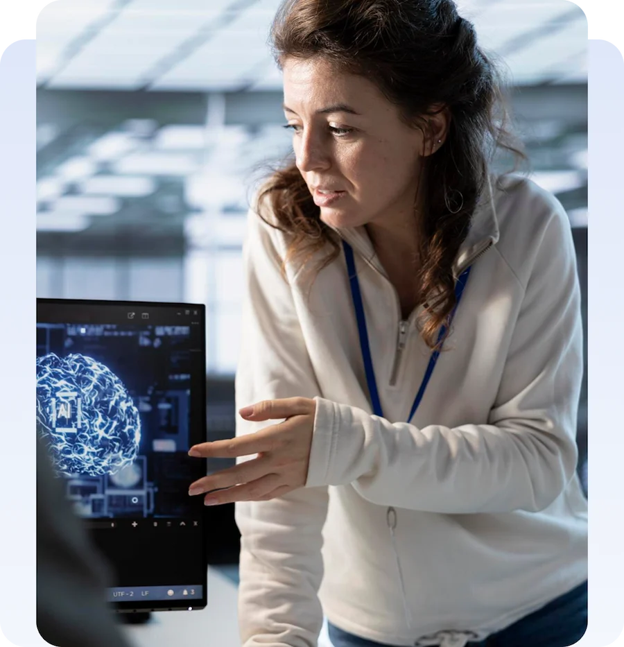 Choose Us Photo Technology professional presenting an artificial intelligence brain visualization on a computer screen.