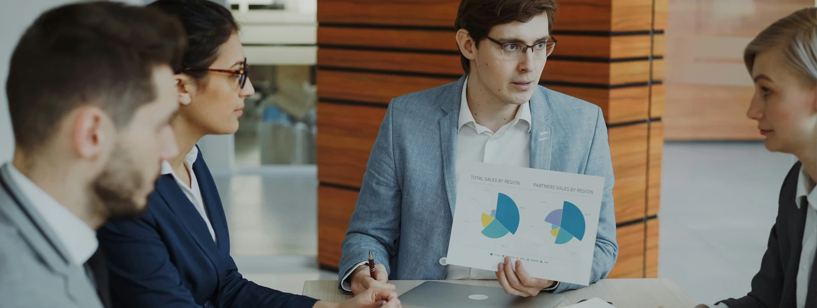 Investor Bigger Size Business team reviewing sales charts during a meeting.
